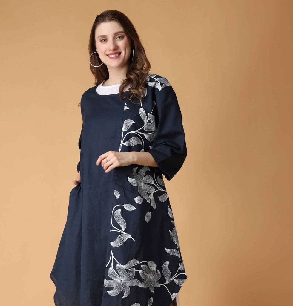 Model wearing two layered floral printed dress