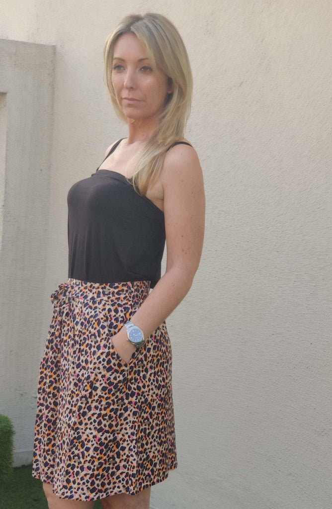 Model wearing Rayon Mini Skirt with Pattern type: Leopard-2
